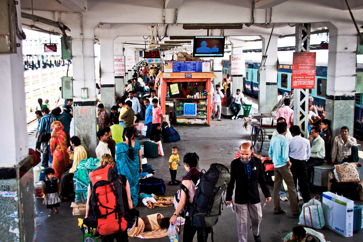 Passengers and porters on a platform at Secunderabad Junction.